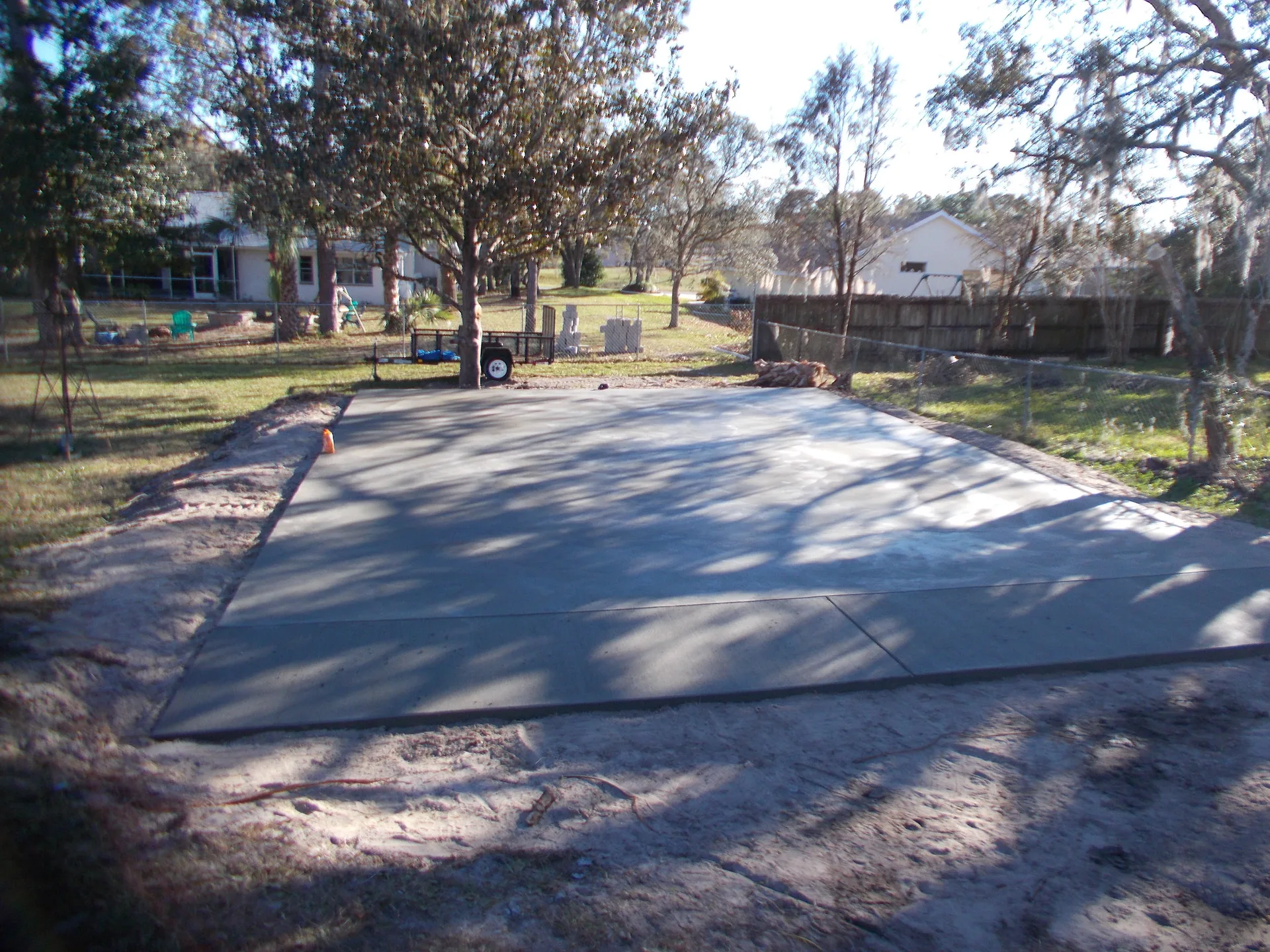 Pole barn pad base being compacted on a Severn Township property near the Shield edge.